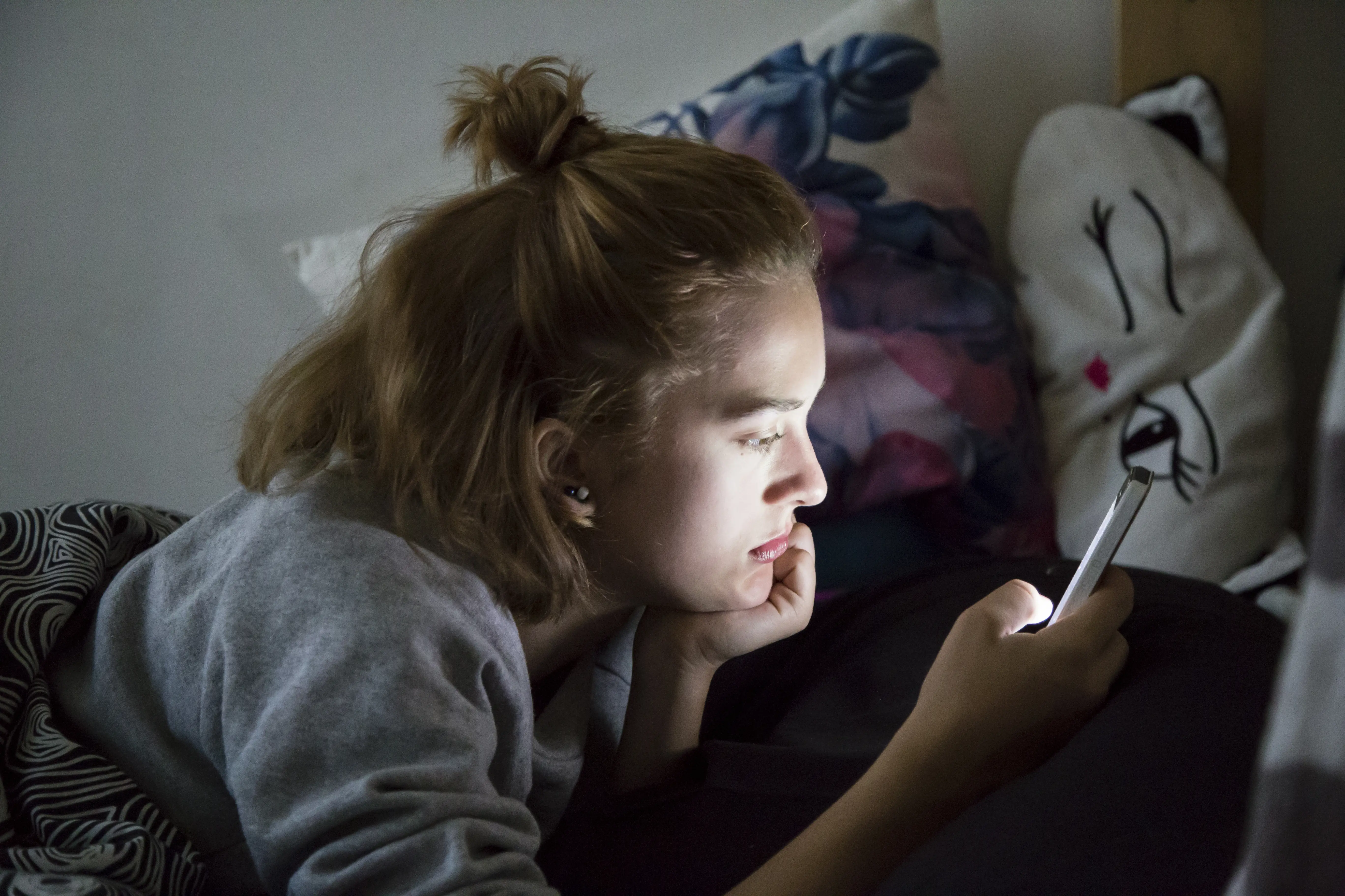 Teen In Bed On Phone