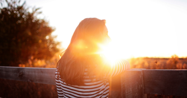 Woman Looking At Sunset